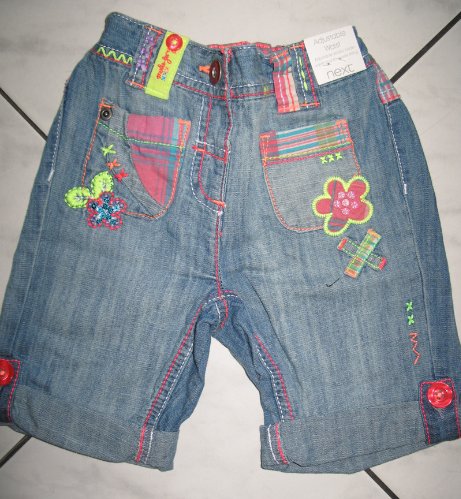 NEXT dziewczęce spodnie jeansy w kwiaty r.86